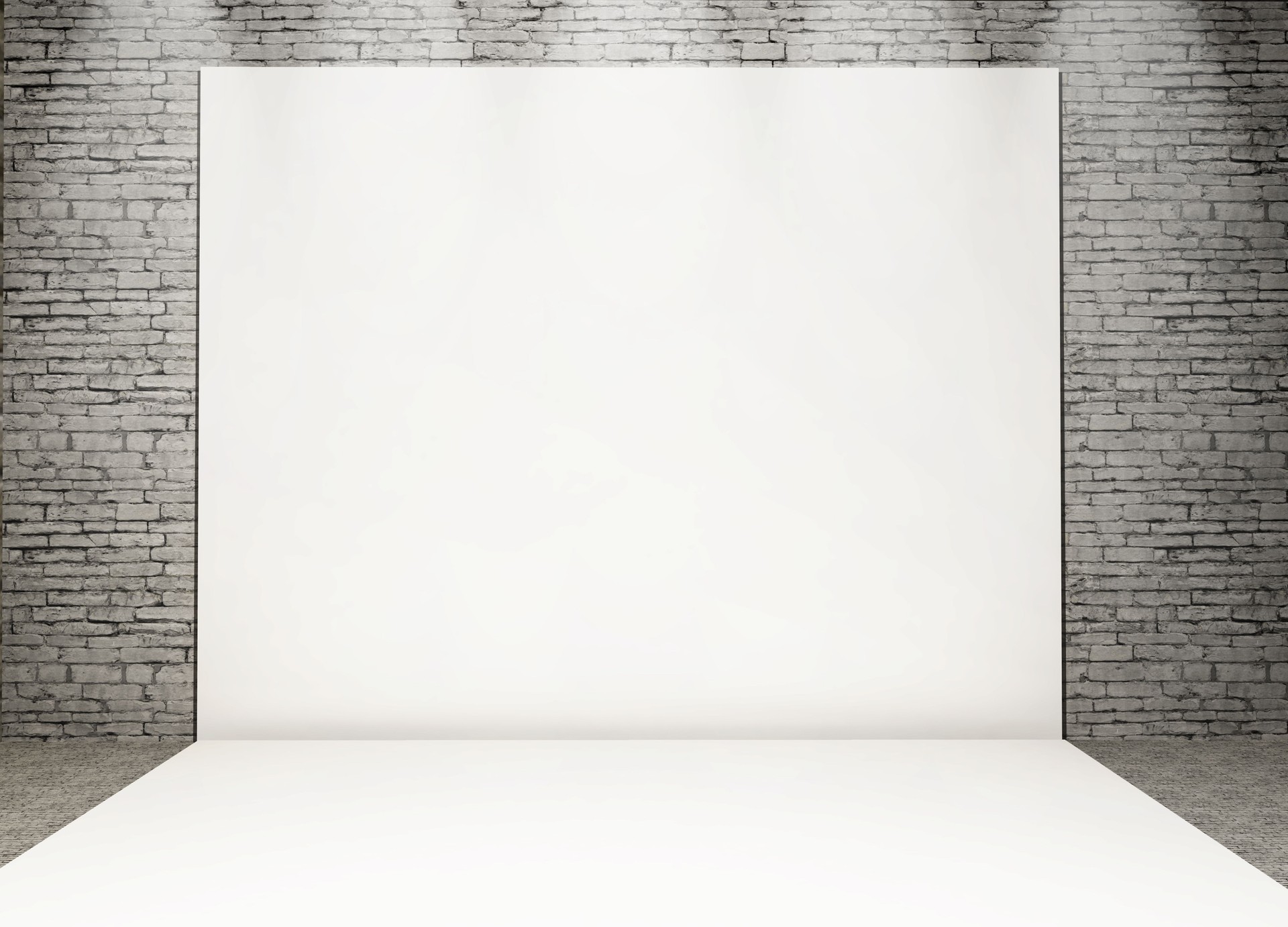 3D white photo back drop in a grunge brick interior